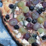 vegetarian pizza with feta, olives and pine nuts