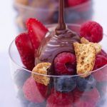 pick your own - berry fruit with biscuit and chocolate drizzled on top
