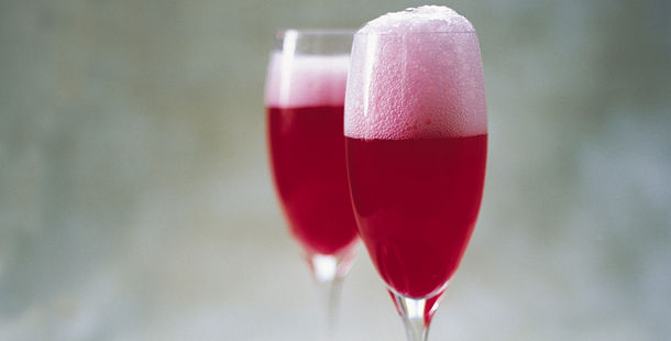 red champagne cocktail with foam on top