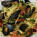 mussel linguine pasta dish with tomatoes and herbs