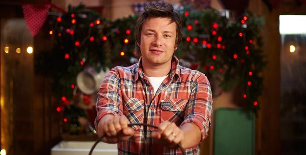 jamie oliver at christmas with christmas decorations behind him