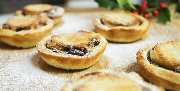 homemade mince pies baked with icing sugar on top
