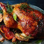 perfect turkey for christmas day with lemon and herbs on top