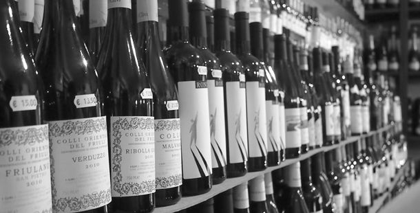 wine in a row on shelves