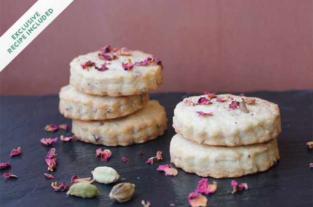 indian shortbread cookies with edible flowers on top