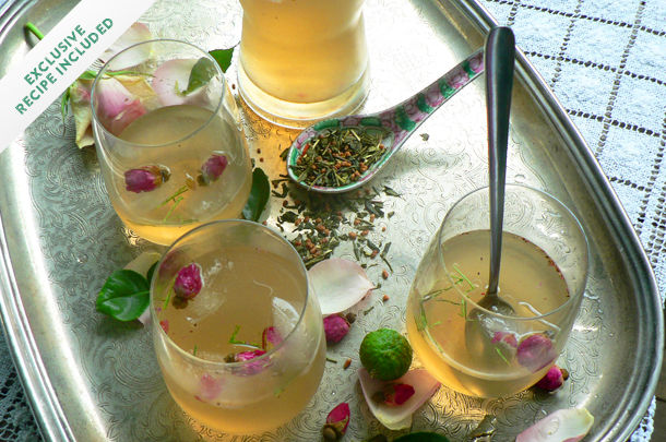 iced tea with alcohol added and rose buds in the drinks