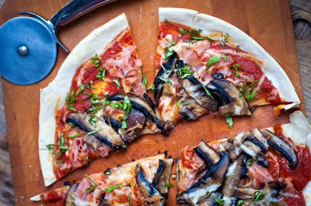 healthy pizza with ham and mushrooms on top