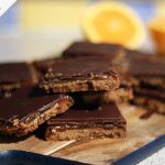 chocolate biscuits with orange slices on the side