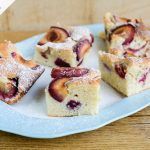 polish plum cake with icing sugar dusted on top and cut into slices