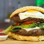 fried noodle burger bun with pak choi and egg
