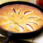 peach and rosemary campfire cake in a pan