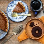 A dairy-free pumpkin pie recipe with doughnuts on the table.