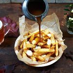 poutine - chips with gravy and creme with beer