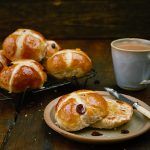 homemade hot cross buns toasted with butter and tea