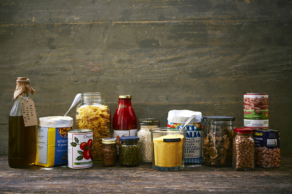selection of jars and cans with labels on - italian ingredients