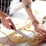 Biscuits recipes - woman cutting out biscuits shapes into dough
