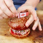 canada day burger with a canadian flag on top