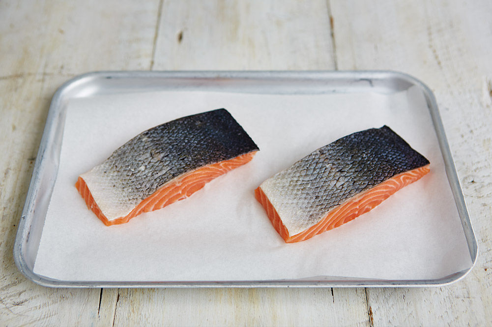 healthy fish - 2 pieces of raw salmon on a tray
