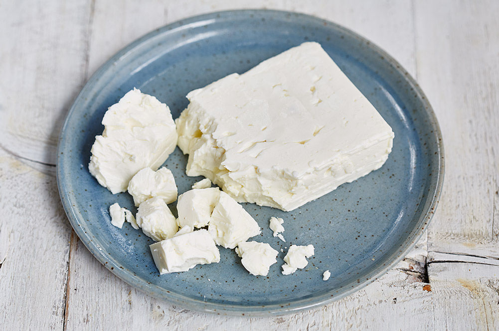 feta cheese in a block, crumbled