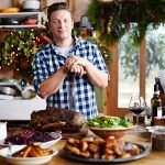 jamie oliver in kitchen at christmas with a christmas roast cooked