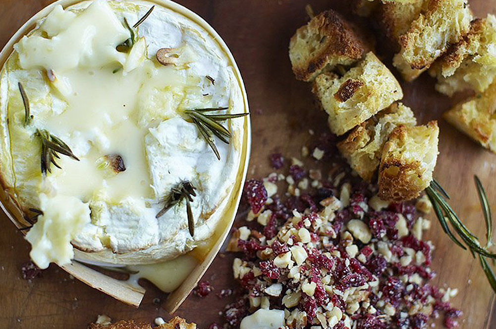 camembert with garlic and rosemary baked inside and crispy bread on the side