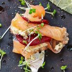 smoked salmon with meat and cress and a slice of lemon