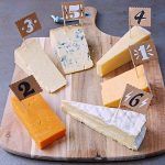 cheeseboard filled with different types of cheese