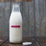 How to make almond milk - bottle of almond milk with label on