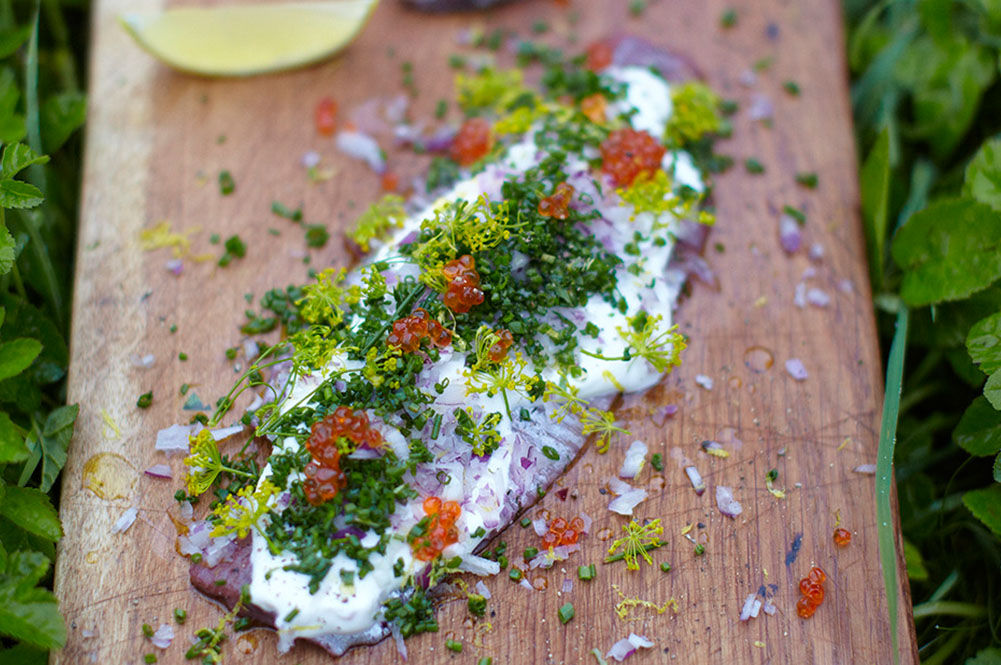 herring recipe with chopped herbs on top