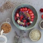 omega feature - bowl of fruit with grains, seeds and oats