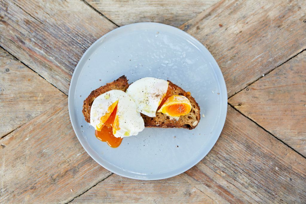poached eggs cut in half on bread