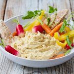 houmous with sliced veg and pitta slices for dipping