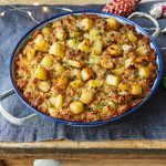 gluten-free stuffing in a pan with potatoes
