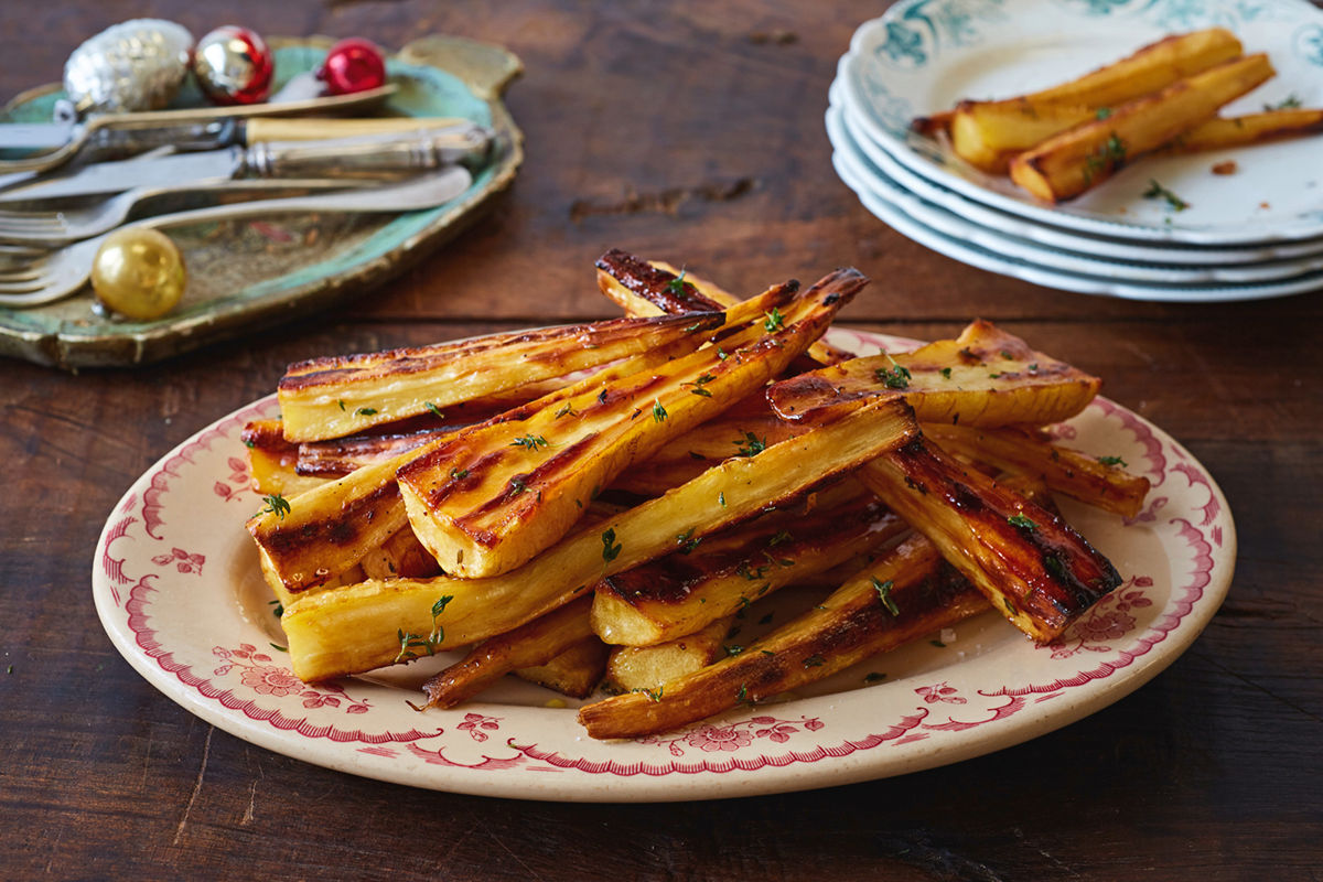 roasted parsnips on a plate with seasoning