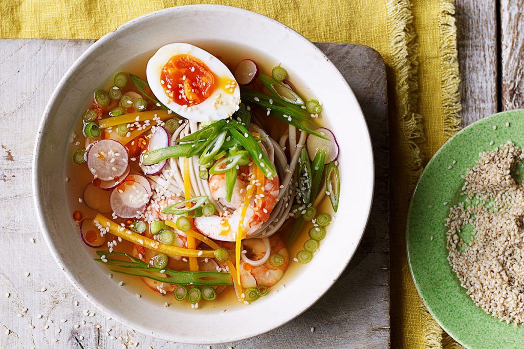 asian prawn and noodle soup with boiled egg and spring onions