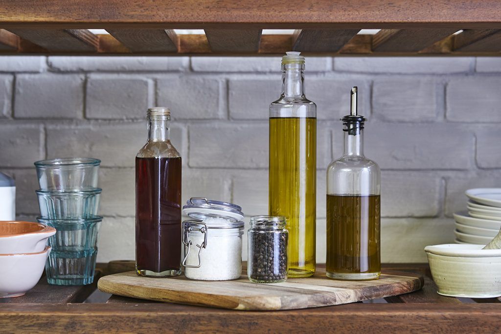 olive oils, salt and pepper in cupboard