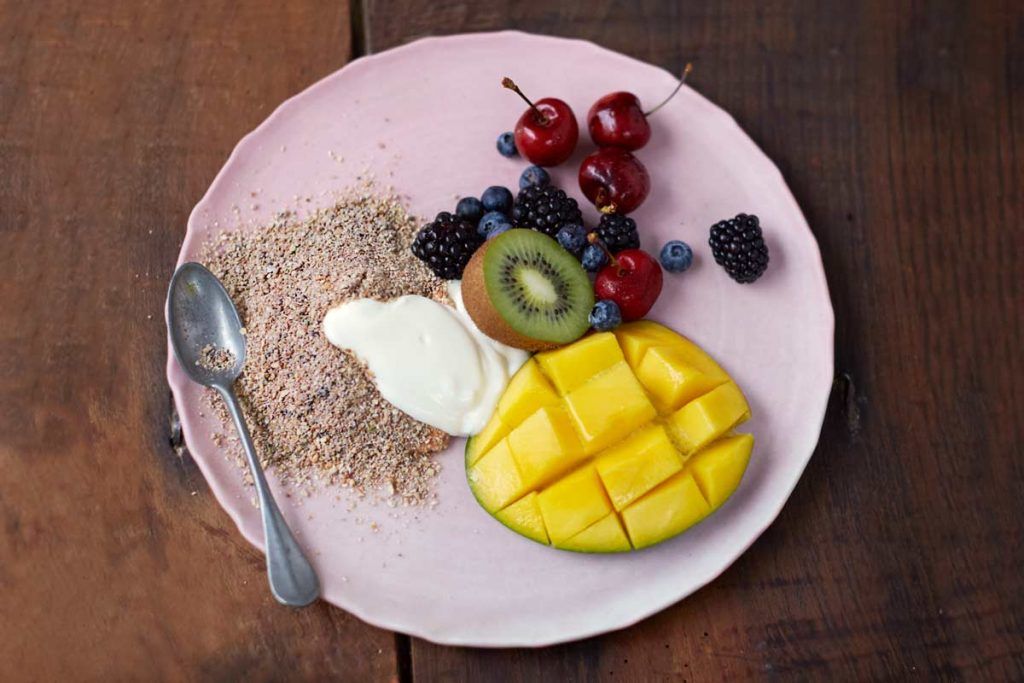 Healthy granola breakfast with yoghurt and fruit