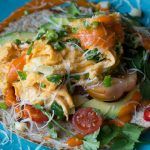 Mexican recipes - flatbread with hot sauce, cheese, tomatoes and herbs
