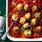 leftover chicken meatballs in tomato sauce with parmesan and herbs on top