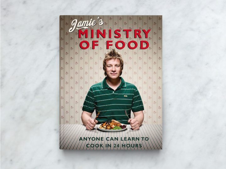Jamie's Ministry of Food cookbook front cover, with Jamie ready to dig into a plate of food as the book cover image.