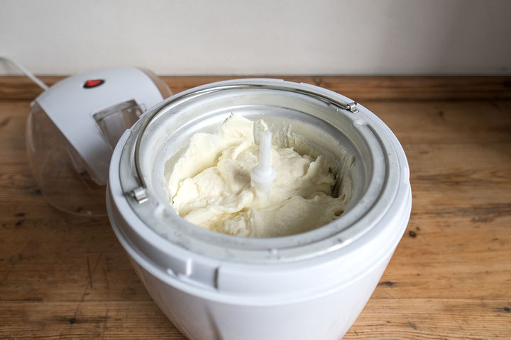 Image of cream and milk in ice cream maker being blended into gelato