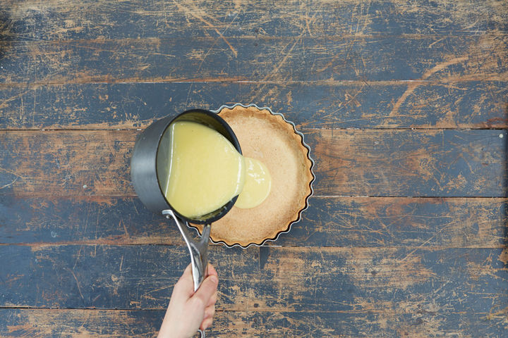 Image of lemon curd being poured into base