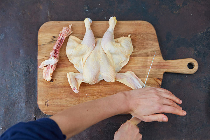 Image of chicken wings being cut off