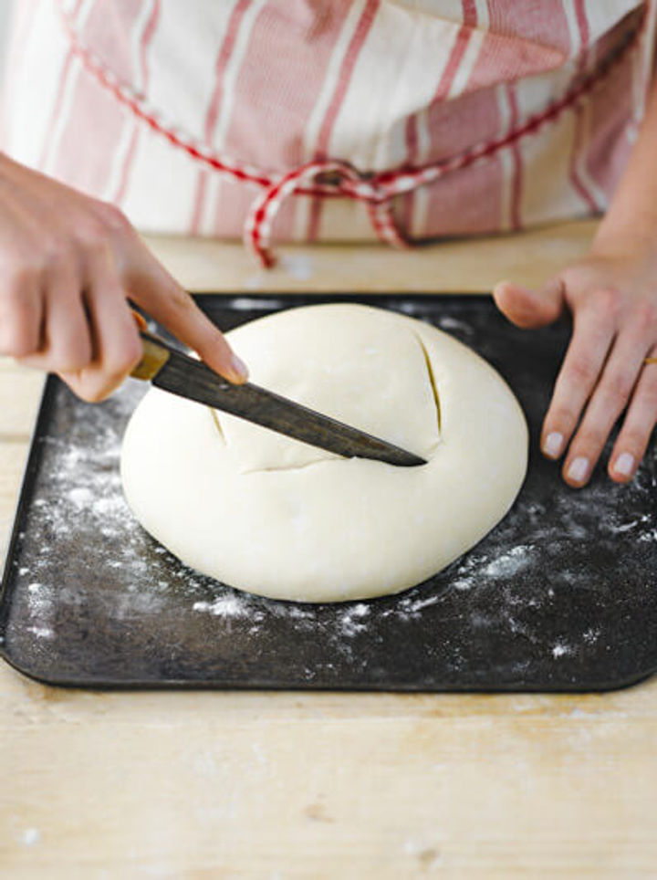 Image of kneaded dough being scored