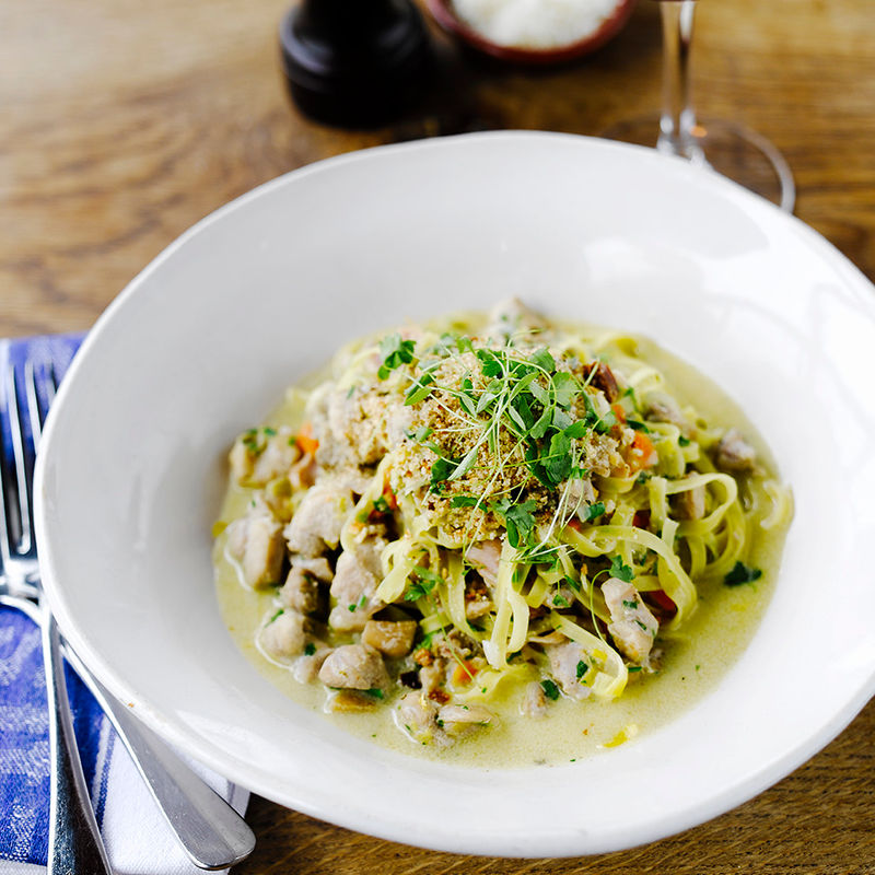 Fusilli pasta with rabbit ragù on carrot mousse