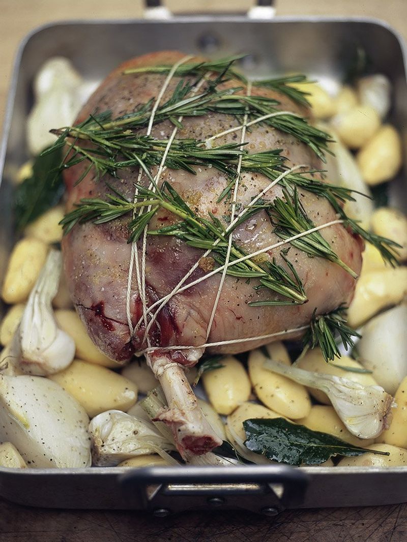 Leg of lamb stuffed with olives, bread, pine nuts and herbs (Cosciotto d'agnello ripieno di olive, pane, pinoli e erbe aromatiche)