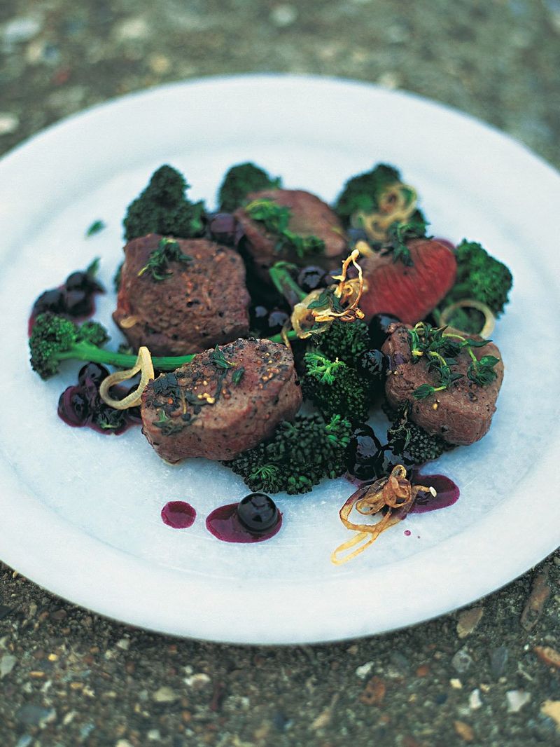 Pan-seared venison with blueberries, shallots and red wine