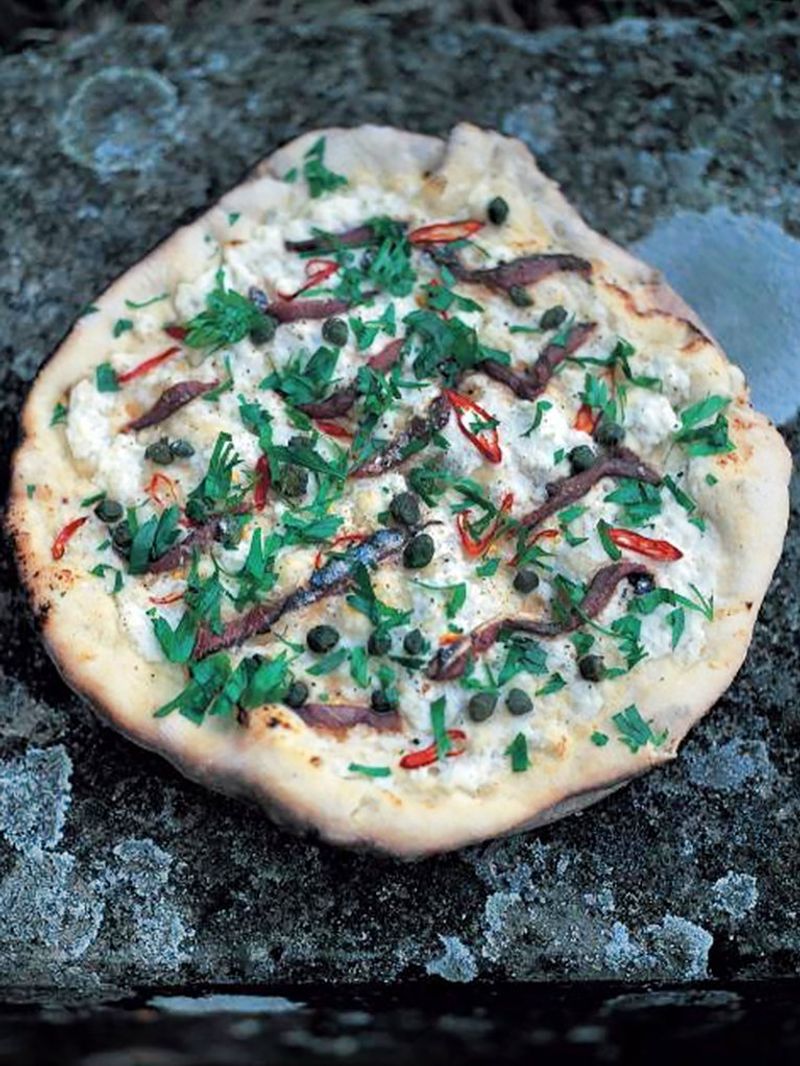 Mozzarella, anchovies, chilli, capers and parsley pizza topping