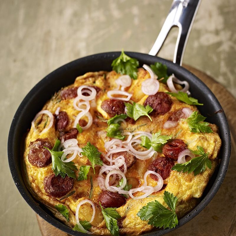 Potato and chorizo omelette with a kinda parsley salad image