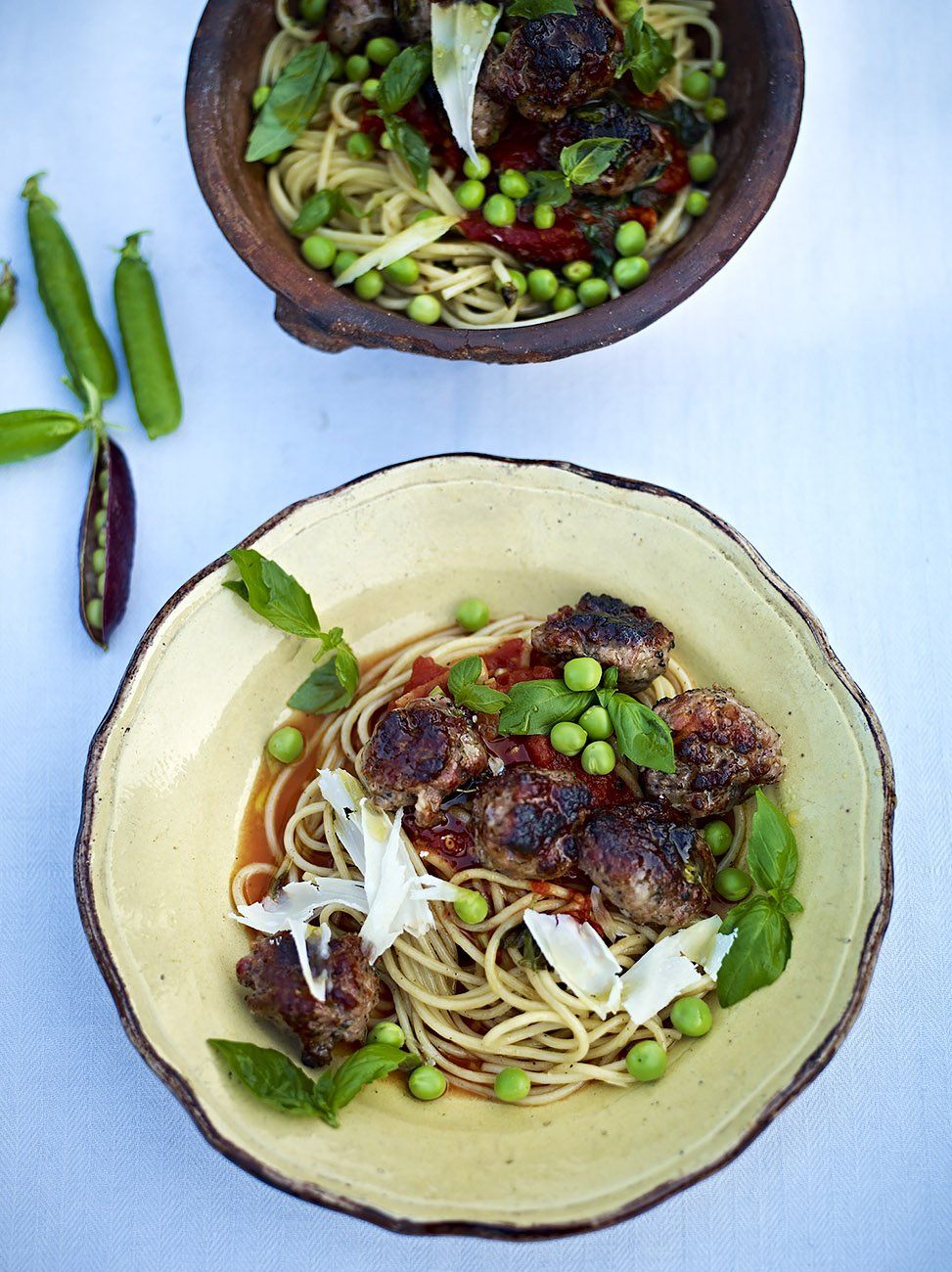 Quick sausage meatballs with a tomato basil sauce spaghetti sweet raw peas